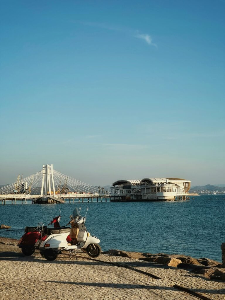 Durres Waterfront View from Sfinksi Promenade - Azure Waters, Blue Sky, and Pista Hotel Bridge in Albania