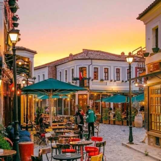 Lively scene at the new bazaar in Korça with coffee shops and terrace seating, showcasing a mix of modern and traditional styles.