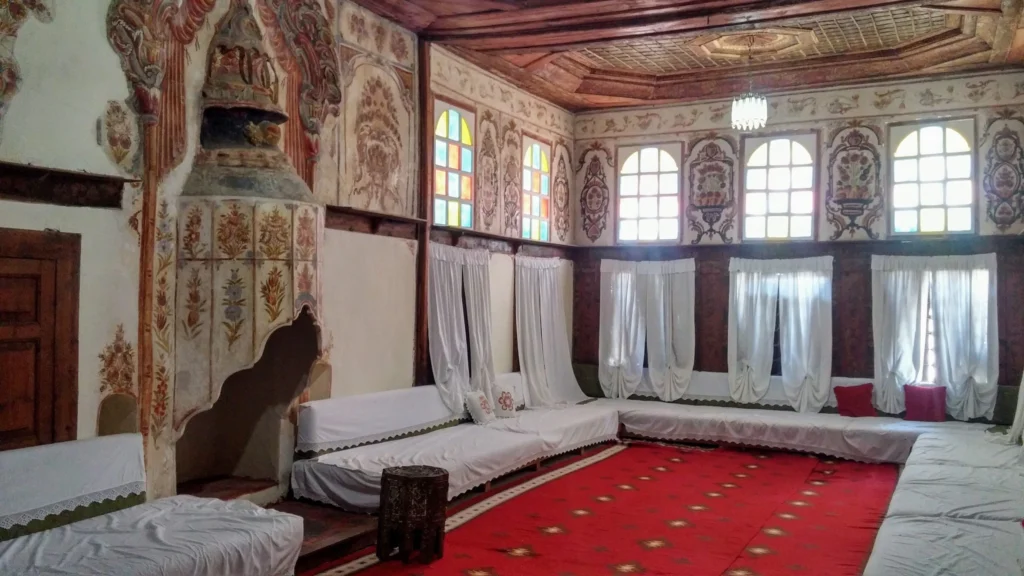 A neat room at the Ethnographic Museum in Gjirokaster, depicting traditional Gjirokaster house interiors and lifestyle.